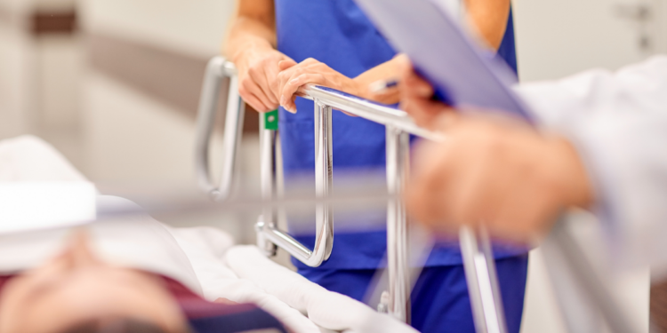 women lies in hospital bed