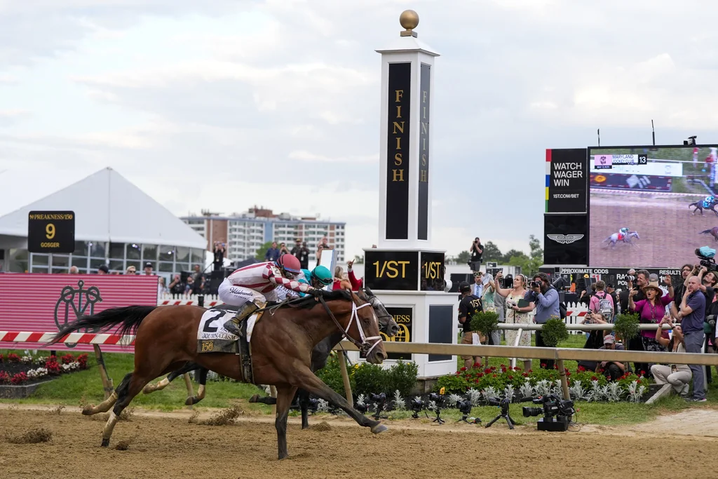 Umberto Rispoli, atop Journalism, left, edges out Luis Saez, atop Gosger, to win the 150th running of the Preakness Stakes horse race Saturday, May 17, 2025, at Pimlico Race Course in Baltimore.