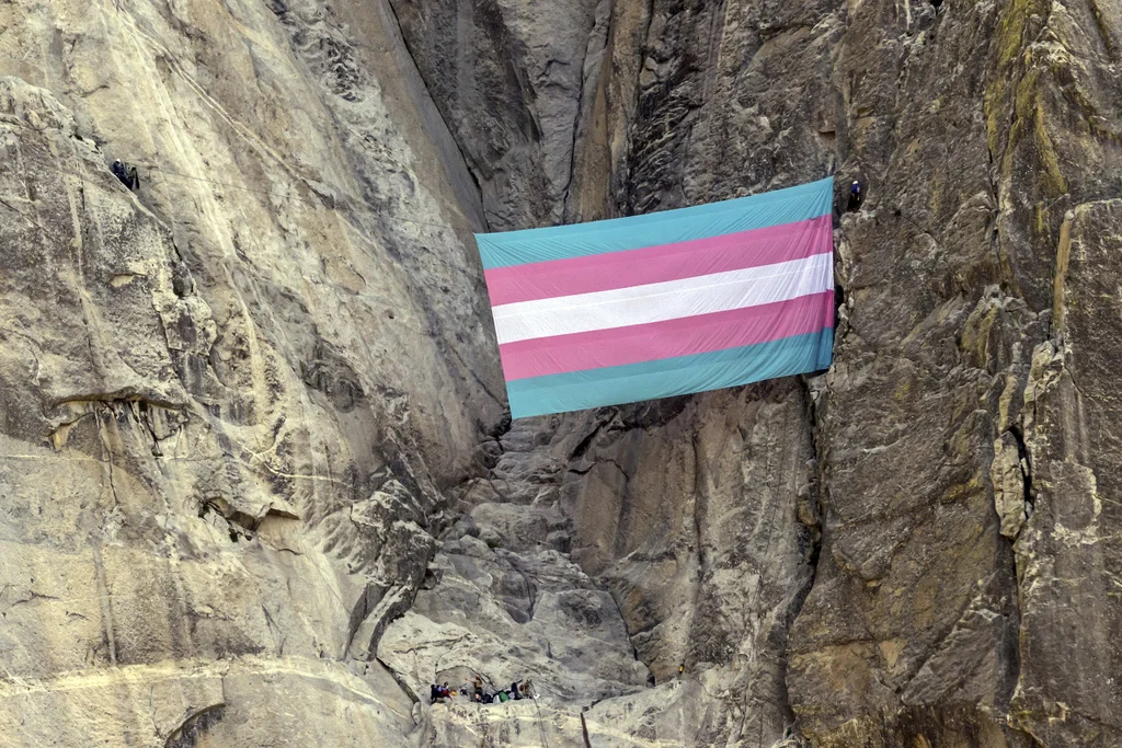 A group of climbers unfurl a trans pride flag on El Capitan in Yosemite National Park, Calif., on Tuesday, May 20, 2025.