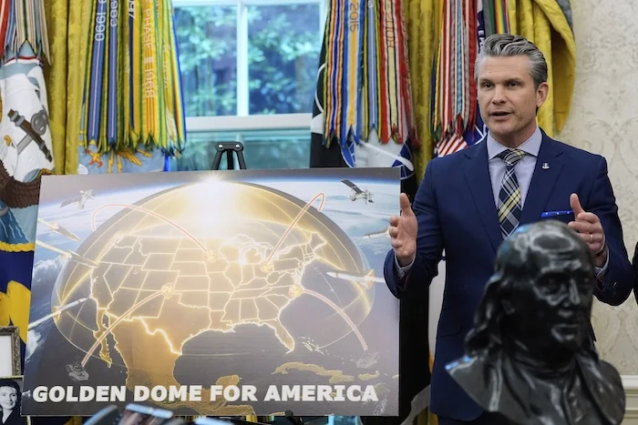 Defense Secretary Pete Hegseth speaks during an event with President Donald Trump in the Oval Office of the White House, Tuesday, May 20, 2025, in Washington.