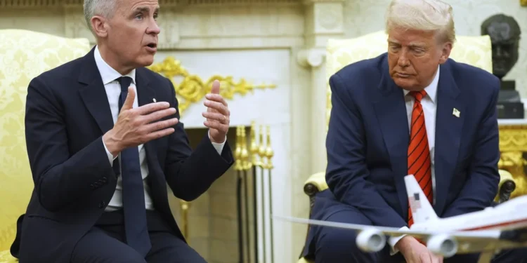 President Donald Trump meets Canadian Prime Minister Mark Carney in the Oval Office of the White House, Tuesday, May 6, 2025, in Washington. (AP Photo/Evan Vucci)