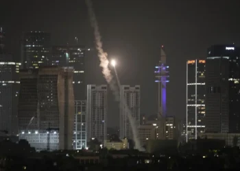 Israeli air defense system fires to intercept missiles over Tel Aviv, Israel, early Sunday, June 15, 2025.