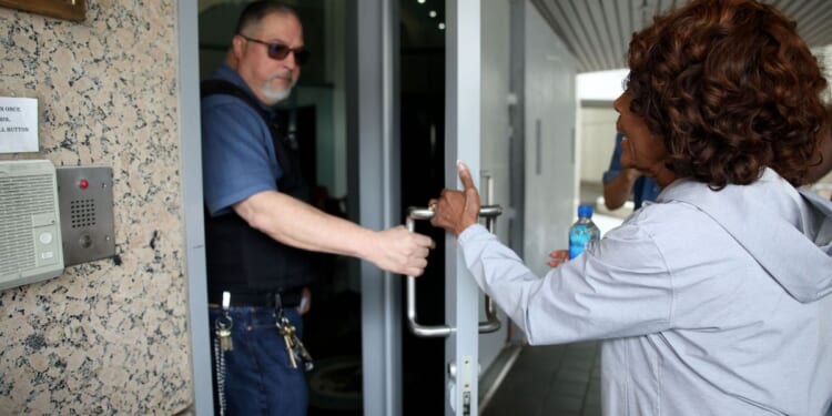 Officer slams door in Rep. Maxine Waters' face when she tries to check in on union president arrested in ICE rioting