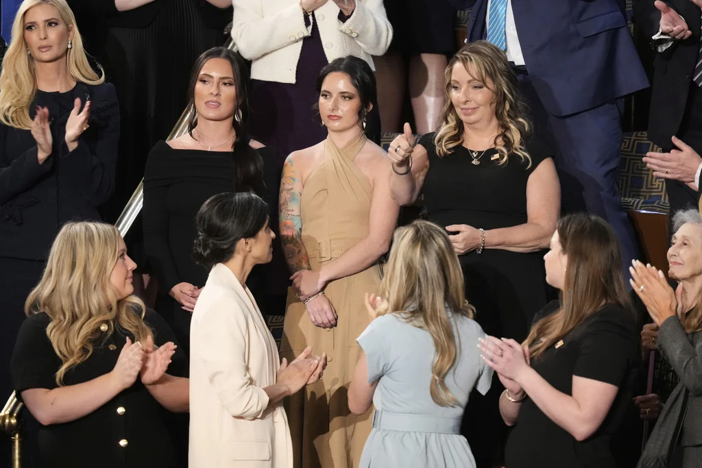 Members of the Corey Comperatore family including wife Helen and daughters Allyson and Kaylee stand as second lady Usha Vance, bottom second left, and Ivanka Trump, top left, applaud as President Donald Trump addresses a joint session of Congress at the Capitol in Washington, Tuesday, March 4, 2025. 