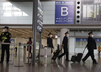 China blocks two Americans from leaving country