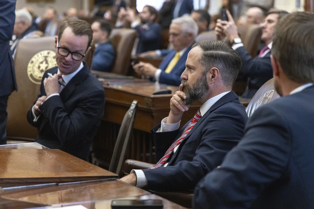 Texas state Rep. Dustin Burrows, R-Lubbock, right, waits results in the speaker race with former Speaker Dade Phelan, R-Beaumont, during opening day of the 89th Texas Legislative Session in Austin, Texas, Tuesday, Jan. 14, 2025. 