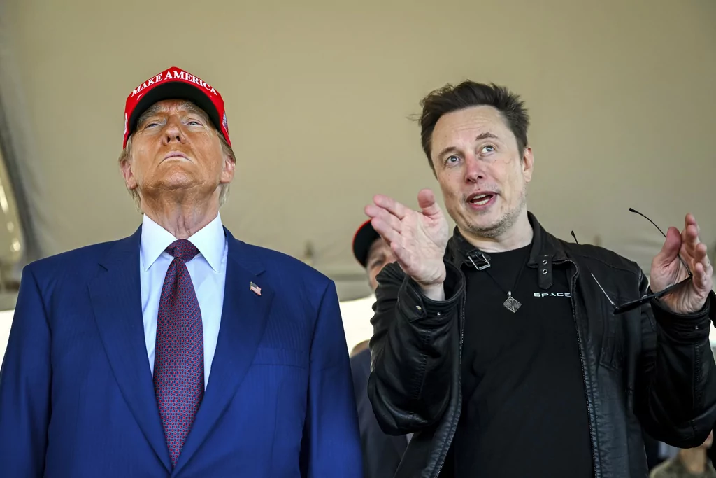 President-elect Donald Trump listens to Elon Musk as he arrives to watch SpaceX's mega rocket Starship lift off for a test flight from Starbase in Boca Chica, Texas, Nov. 19, 2024.