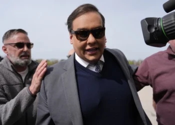 George Santos reports to prison after pleading for pardon and suggesting he’ll die there