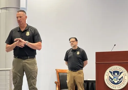 Acting Immigration and Customs Enforcement Director Todd Lyons (left) speaks to reporters at the Federal Law Enforcement Training Center in Glynco, Georgia, Aug. 21, 2025.