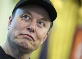 Elon Musk listens as President Donald Trump speaks during a news conference in the Oval Office of the White House, Friday, May 30, 2025, in Washington.