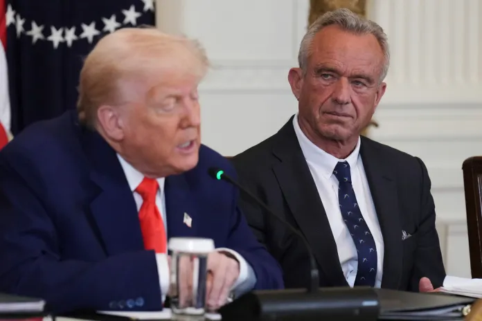 FILE - President Donald Trump, left, speaks as Health and Human Services Secretary Robert F. Kennedy Jr. listens during a Make America Healthy Again Commission Event in the East Room of the White House, Thursday, May 22, 2025, in Washington.