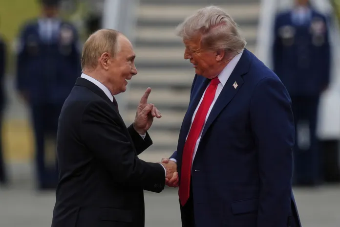 President Donald Trump greets Russia's President Vladimir Putin Friday, Aug. 15, 2025, at Joint Base Elmendorf-Richardson, Alaska.