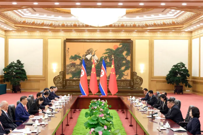 In this photo released by Xinhua News Agency, Chinese President Xi Jinping, third left, holds talks with North Korean leader Kim Jong Un, second right, at the Great Hall of the People in Beijing, China, Thursday, Sept. 4, 2025.