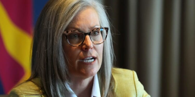 CCP businessman slides check to governor after she blocks anti-China bills