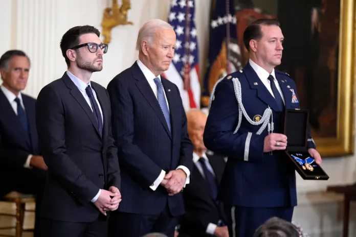 President Joe Biden presents the Presidential Medal of Freedom to Alex Soros on behalf of his father George Soros.