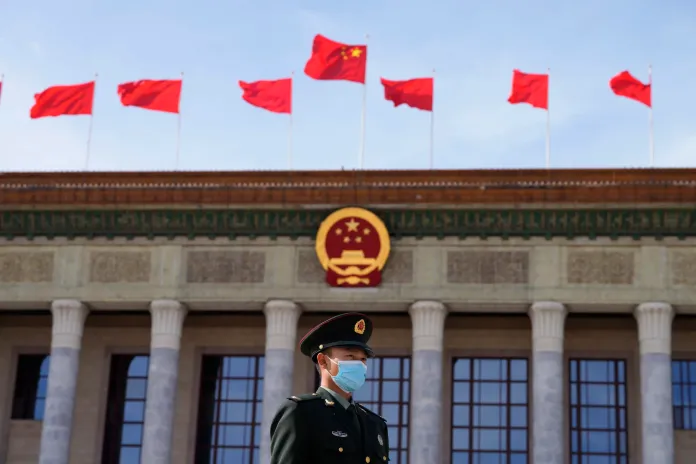 A Chinese soldier stands guard outside the Great Hall of the People.