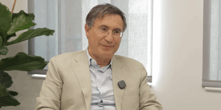 Christopher Hohn talking during an interview.