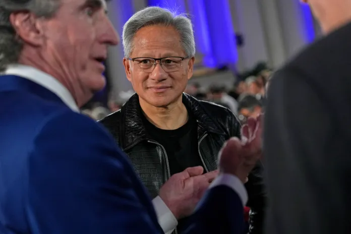Nvidia CEO with Doug Burgum at AI summit in July.