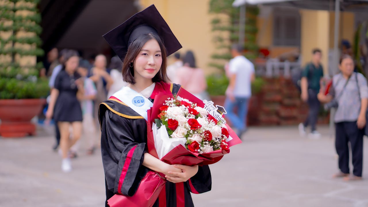 chinese college student in cap and gown