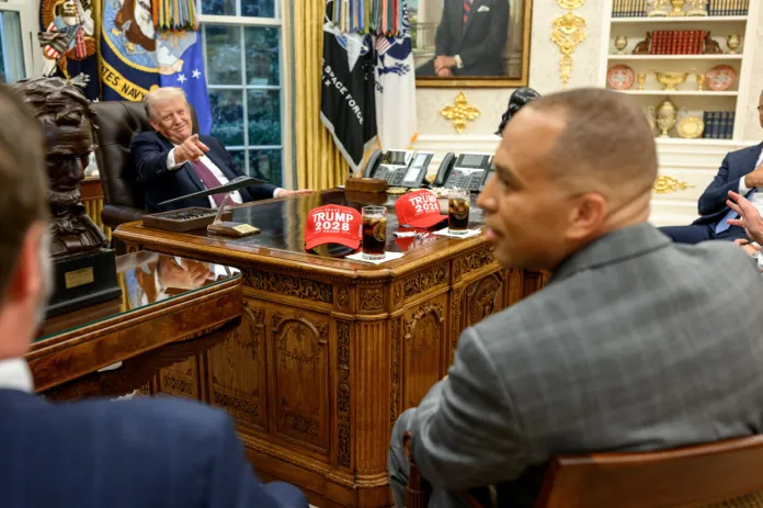 Donald Trump points to Trump 2028 hats during a meeting with congressional leadership on Sept. 29, 2025.