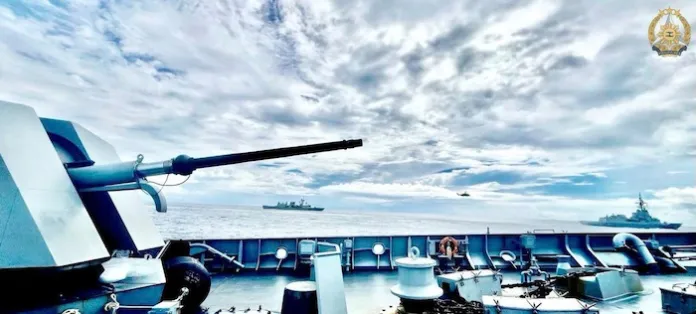 Philippine Navy BRP Jose Rizal sailing in formation with Australian Navy HMAS Brisbane and Canadian Navy frigate HMCS Ville de Québec.