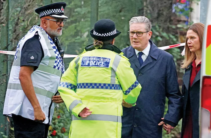 British Prime Minister Keir Starmer talks to police outside Manchester’s Heaton Park Hebrew Congregation synagogue, Oct. 3, 2025. (PHIL NOBLE / AFP / Getty Images)