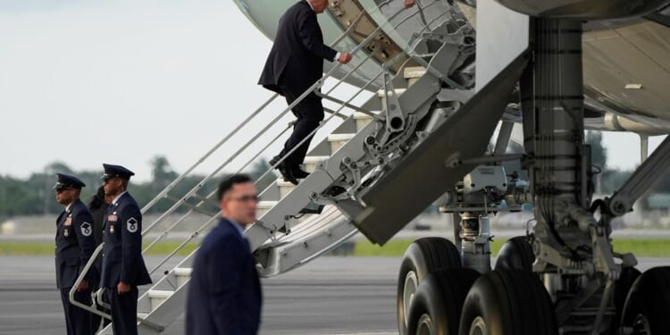 Trump boards Air Force One using small stairs after hunting stand found at airport