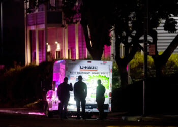 Officers shoot truck driver who backed into Coast Guard base