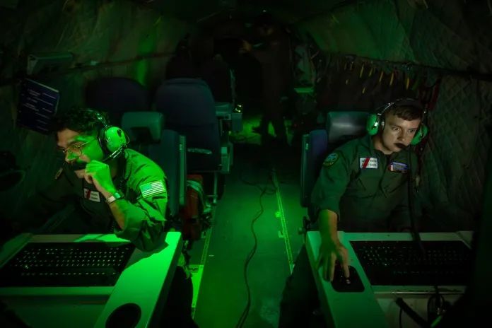 Missions System operator AET3 Caleb McLarty and AET-2 John Montalvo- Valentin onboard a HC-144B Maritime Patrol Aircraft use radar and other technologies to detect illegal fishing activities off the coast of Padre Island, Texas.