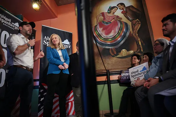 ALEXANDRIA, VIRGINIA - OCTOBER 30: Virginia Democratic gubernatorial candidate, former Rep. Abigail Spanberger (2nd L) listens as Sen. Ruben Gallego (L) (D-AZ) speaks during a campaign event at Los Tios Grill on October 30, 2025 in Alexandria, Virginia. Spanberger will face off against Republican candidate Winsome Earle-Sears in the Commonwealth of Virginia’s off-year election for governor and other statewide offices on November 4.