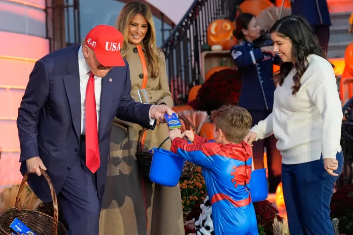 President Donald Trump and first lady Melania Trump participate in a Halloween event