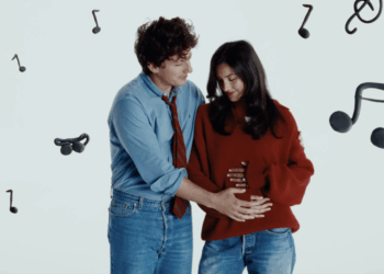 Charlie Puth holds wife's pregnant belly