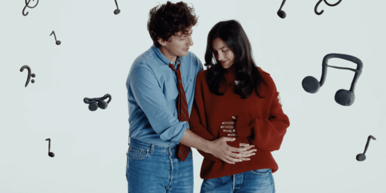 Charlie Puth holds wife's pregnant belly