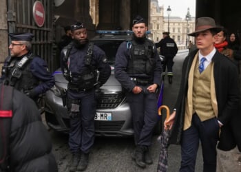 Mystery man in an AP photo after the Louvre jewel heist creates a buzz