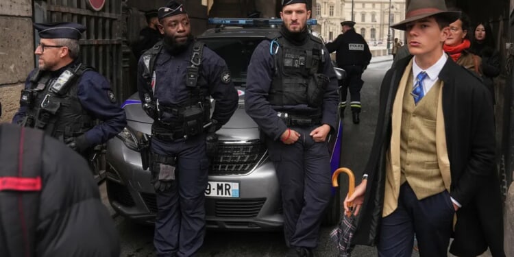 Mystery man in an AP photo after the Louvre jewel heist creates a buzz
