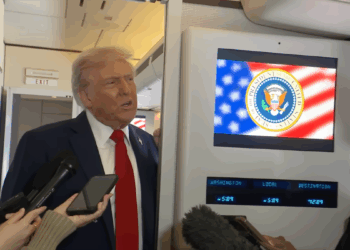 Donald Trump speaking to press on Air Force One