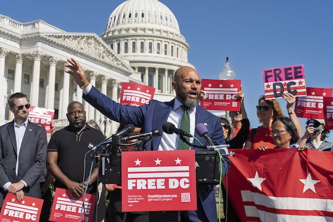 DC Councilmember Robert White, center, joins elected officials in a call to end the presence of National Guard troops in the District of Columbia at the Capitol in Washington, Thursday, Sept. 4, 2025.
