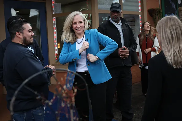 ALEXANDRIA, VIRGINIA - OCTOBER 30: Virginia Democratic gubernatorial candidate, former Rep. Abigail Spanberger jokes with supporters while departing a campaign event at Los Tios Grill on October 30, 2025 in Alexandria, Virginia. Spanberger will face off against Republican candidate Winsome Earle-Sears in the Commonwealth of Virginia’s off-year election for governor and other statewide offices on November 4.