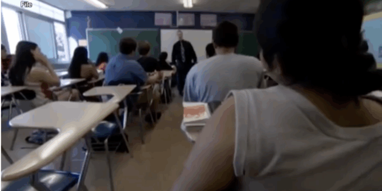 Wisconsin high school students and their teacher in the classroom.