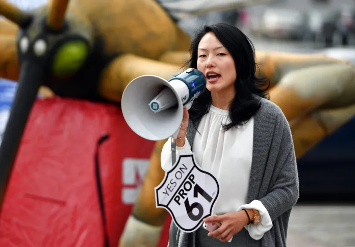 San Francisco County Supervisor Jane Kim addresses a crowd during a "Yes on Prop 61" rally outside City Hall in San Francisco.