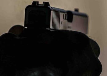 Gun-wielding homeowner wastes no time after he says burglar kicked in his door at midnight, ran toward him when told to stop