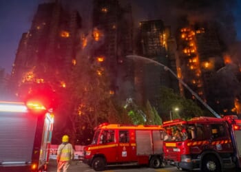 At least 13 killed after massive fire engulfs residential complex in Hong Kong
