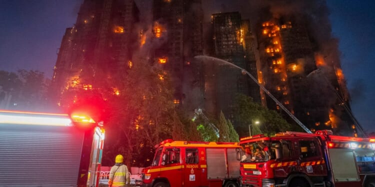At least 13 killed after massive fire engulfs residential complex in Hong Kong