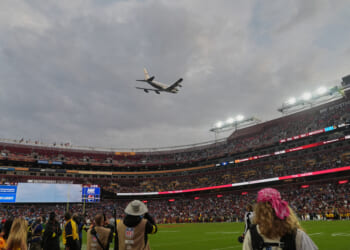 Air Force One conducts flyover of Commanders-Lions game as Trump makes history