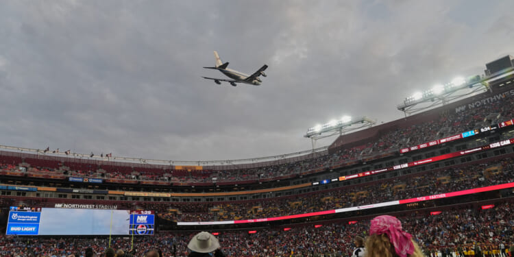 Air Force One conducts flyover of Commanders-Lions game as Trump makes history