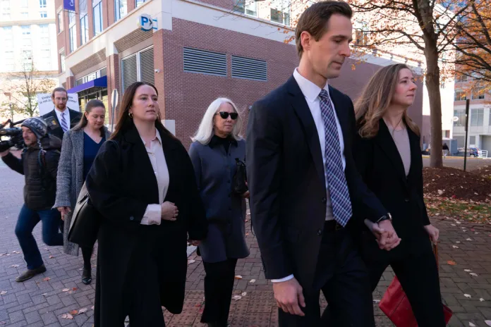 Former FBI Director James Comey's family leaves a federal courthouse.
