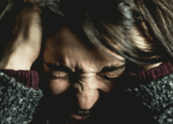 Woman holding her head