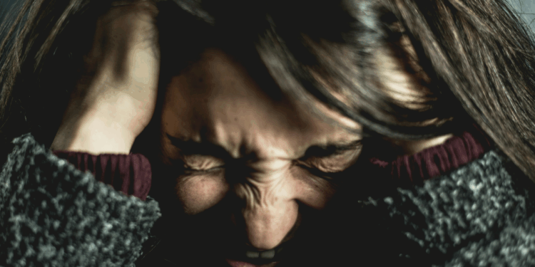 Woman holding her head