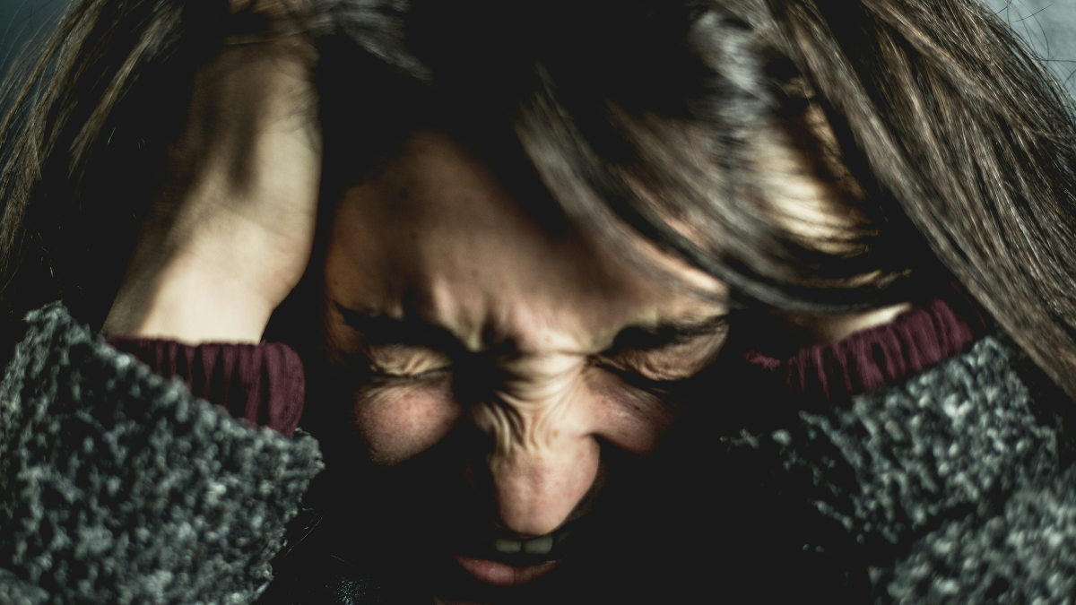 Woman holding her head