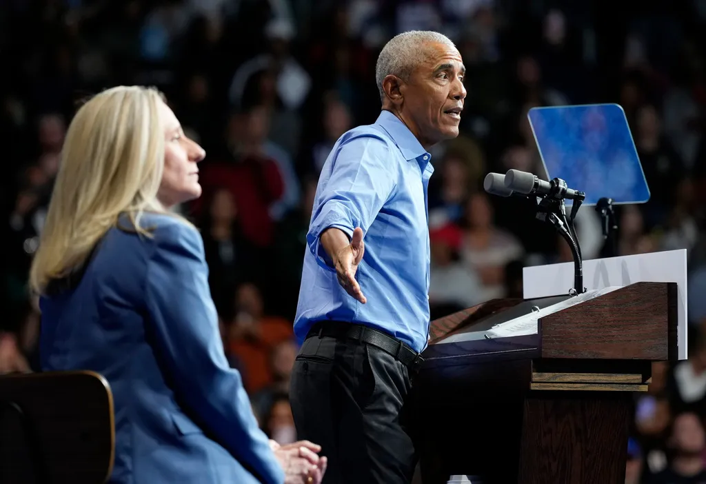 Virginia Democratic gubernatorial candidate Abigail Spanberger listens to former President Barack Obama speak 